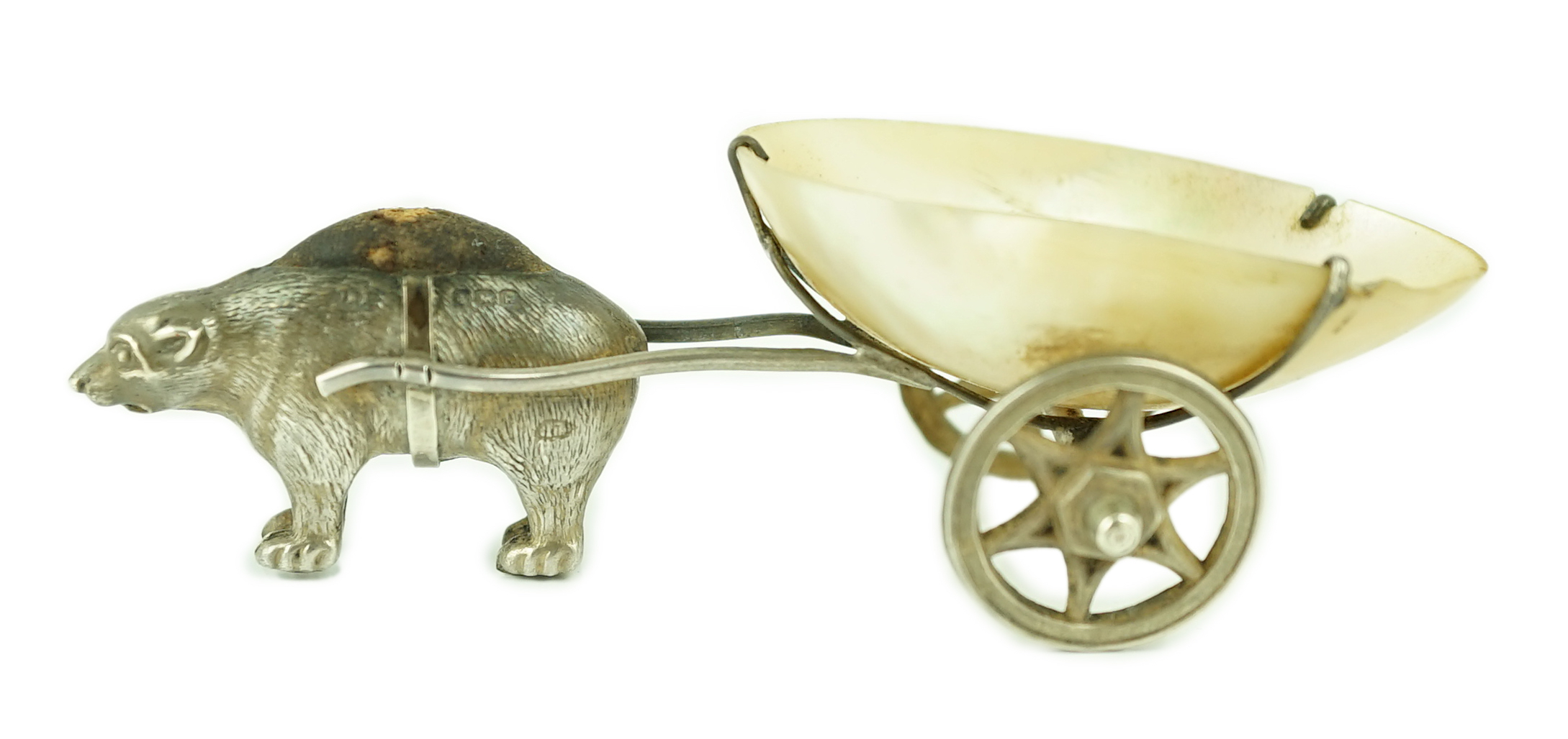 An Edwardian novelty silver and mother of pearl pin cushion, modelled as a bear pulling a cart, Adie & Lovekin Ltd